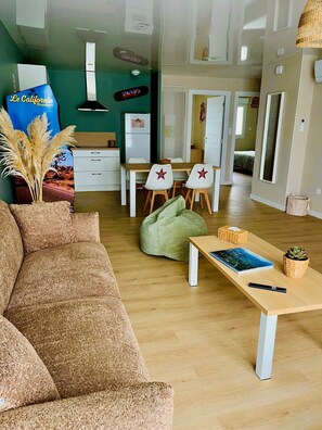 Comfort Apartment | Living area | 165-cm flat-screen TV with digital channels, offices - Le California (Neuf-Mesnil)