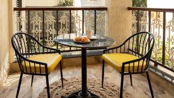 Junior Suite, Balcony, Pool View | Outdoor dining