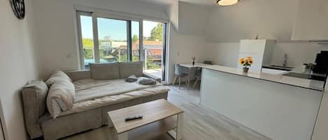 Appartement Deluxe | Coin séjour | Télévision à écran plat