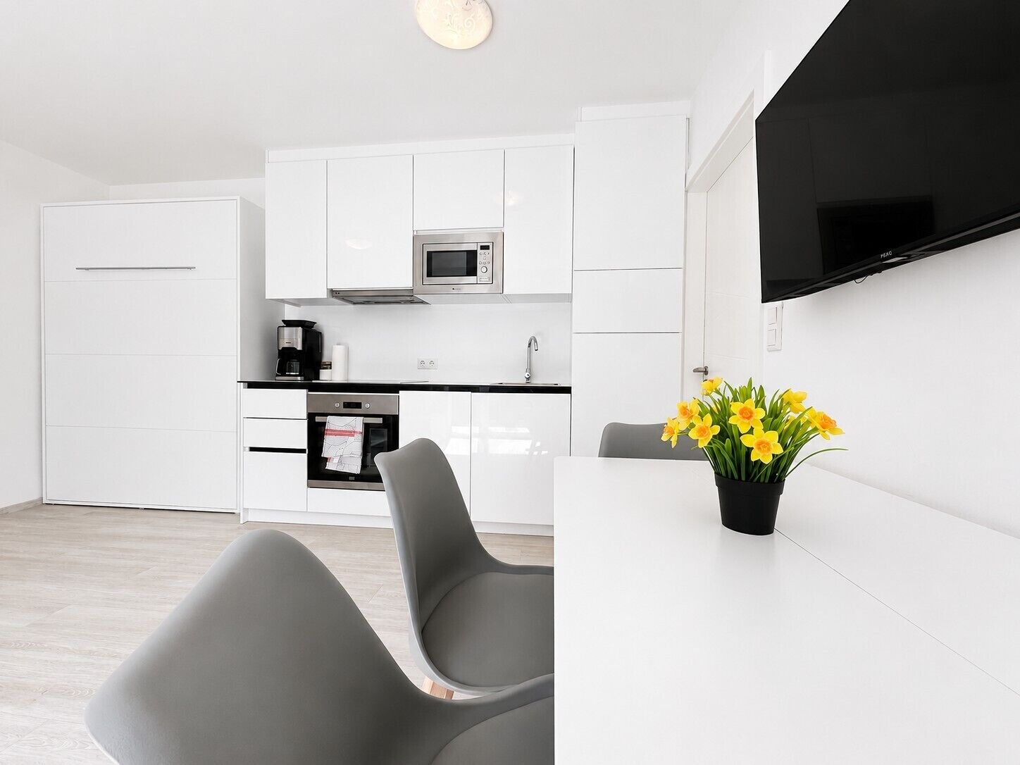 Business Apartment | Living area | Flat-screen TV, heated floors