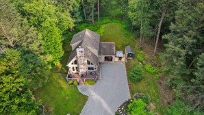 A house with a driveway, a patio, and a small deck. - Near Jfbb With Private Hot Tub and Game Room (Albrightsville)