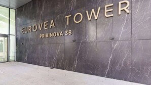 A marble wall with 'EUROVEA TOWER' and 'PRIBINOVA 38' signage. - Eurovea Tower Apt 1 Danube View (Bratislava)