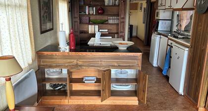 Atypical, secluded chalet in a forest garden, with covered terrace.