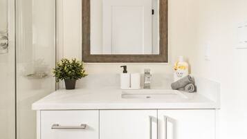 Shower, hair dryer, towels, soap