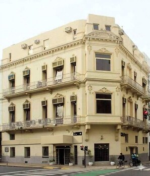 A multi-story building with balconies, large windows, and a corner entrance. - Hotel Capital (Buenos Aires)