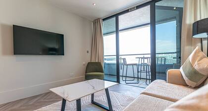 1BR Apt • Balcony • Smart TVs in All Rooms