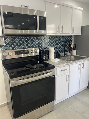 Deluxe Apartment, Ocean View | Private kitchen - Oceanview Rooftop Escape & Pool  (Terranova)