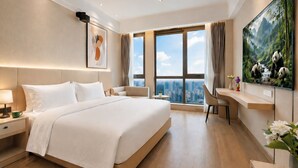A modern hotel room with a large bed, a desk, a chair, a TV, and a city view. - Anara Aparthotel Chengdu Chunxi Road (Chengdu)