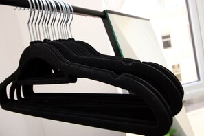 A black hanger on a metal rack. - NEW! Charming 2BR Home in a Popular Urban Quarter (Cardiff)