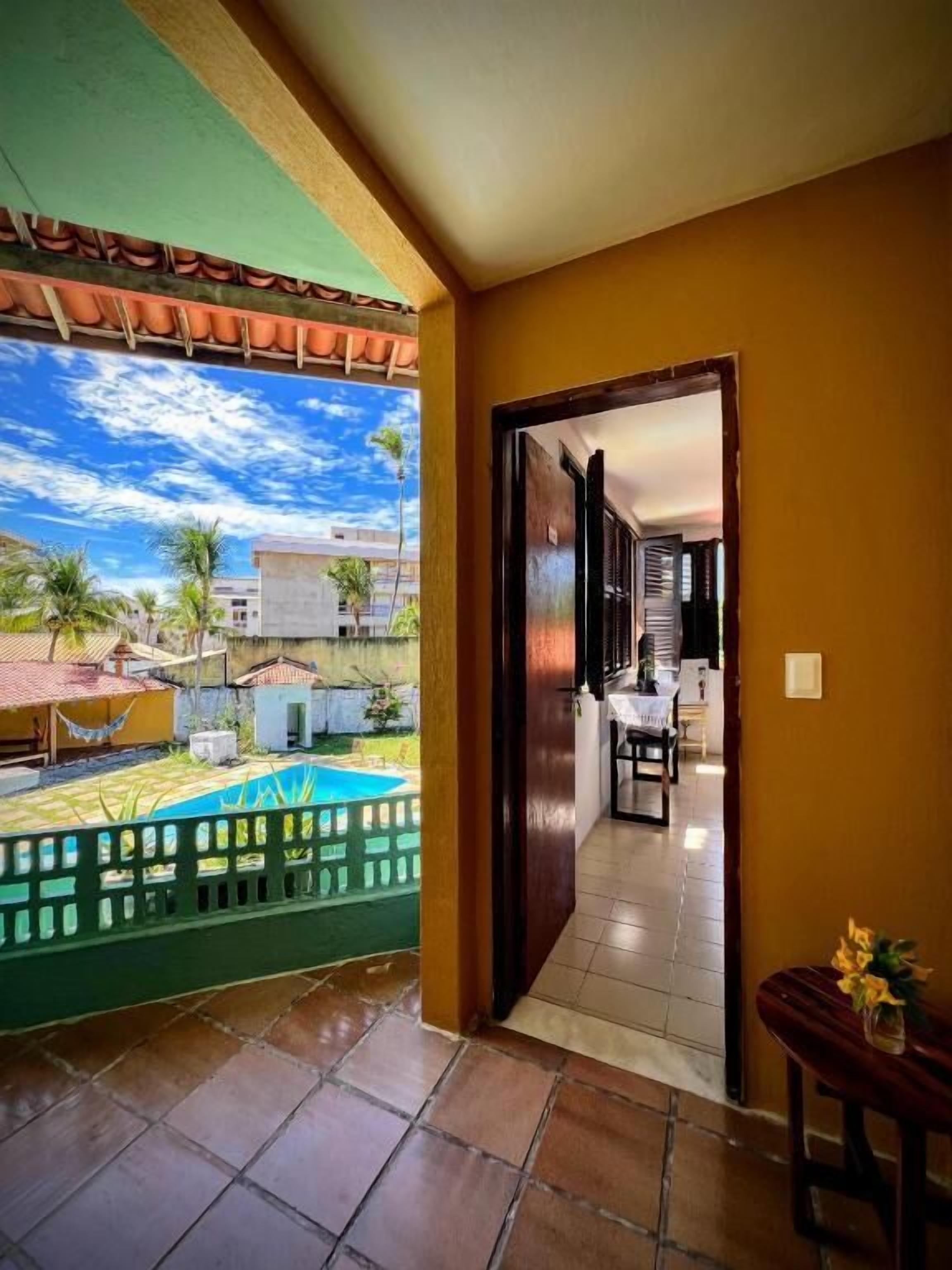 Quarto quádruplo superior, vista para a piscina | Terraço/pátio