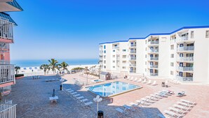 A hotel with a pool, beach view, and multiple balconies. - Family Friendly w/ Balcony and Shared Pool BC1314 (Indian Shores)