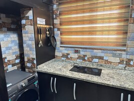 Apartamento Deluxe | Cocina privada