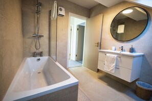 Shower, deep soaking tub, hair dryer, towels