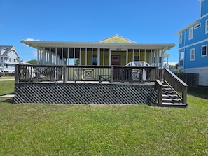 A two-story building with a covered porch and a number '406' sign.