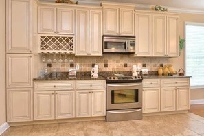 Fridge, microwave, oven, stovetop - Experience Oak Island living in "A Gift From Heaven," a 3BR waterfront retreat for 6. (Oak Island)