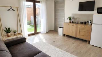 Appartamento, vista giardino | Area soggiorno