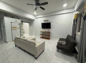 Living area - Modern Cascade 1-bedroom apartment in Port of Spain with AC (Port of Spain)