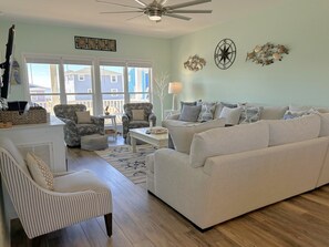 Smart TV, books - Oceanview Key Rest on Oak Island: Spacious 6BR, 5BA home for 15 guests with pool. (Oak Island)