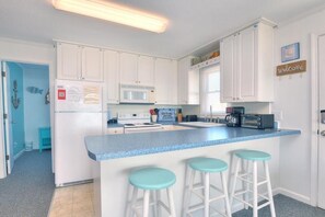 Fridge, microwave, oven, stovetop - Ocean Pearl: Oceanfront house in Oak Island, NC with 3 queen bedrooms and beach access. (Oak Island)