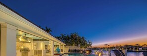 A resort with a pool, outdoor seating, and a view of the water. - LVS Villa Coastal Hideaway Intracoastal Front Luxury, Private Dock, Heated Pool & Spa, 5-Min Walk to Beach (Fort Lauderdale)