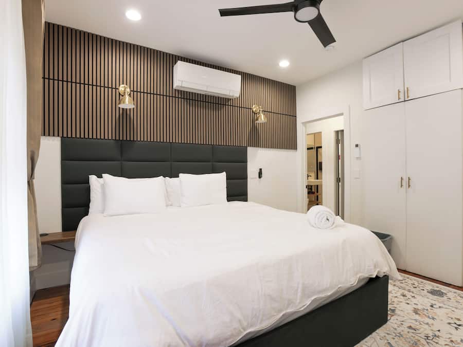 Family Suite, City View | In-room safe, desk, laptop workspace, iron/ironing board