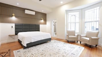 Superior Suite, City View | In-room safe, desk, laptop workspace, iron/ironing board