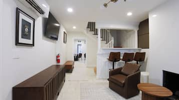 55-inch LED TV with digital channels, fireplace