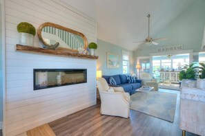 TV, books - Sand Dollar:  Experience renovated 4BR/3BA, Pool, Water Views, Caswell Beach, NC. (Caswell Beach)