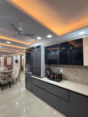 Chambre Deluxe, vue ville | Cuisine partagée