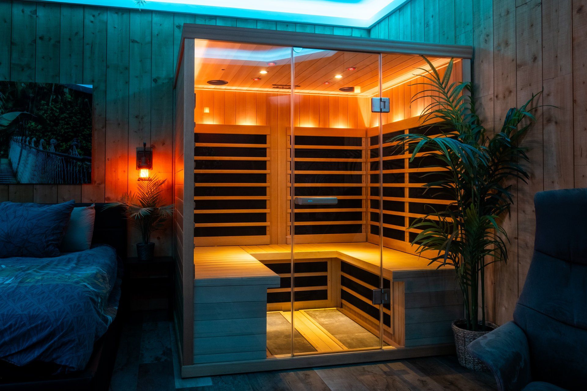 A sauna with a wooden interior, glass walls, and a bench.