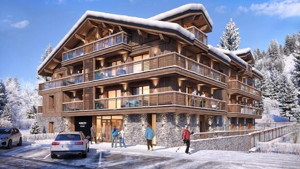 A multi-story wooden lodge with balconies, a stone facade, and a ski slope in the background. - Wifi, 200m from ski slopes, 2nd floor, fitness, swimming pool, sauna, hammam, balcony, tv (Les Gets)