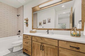 Shower, hair dryer, towels, shampoo