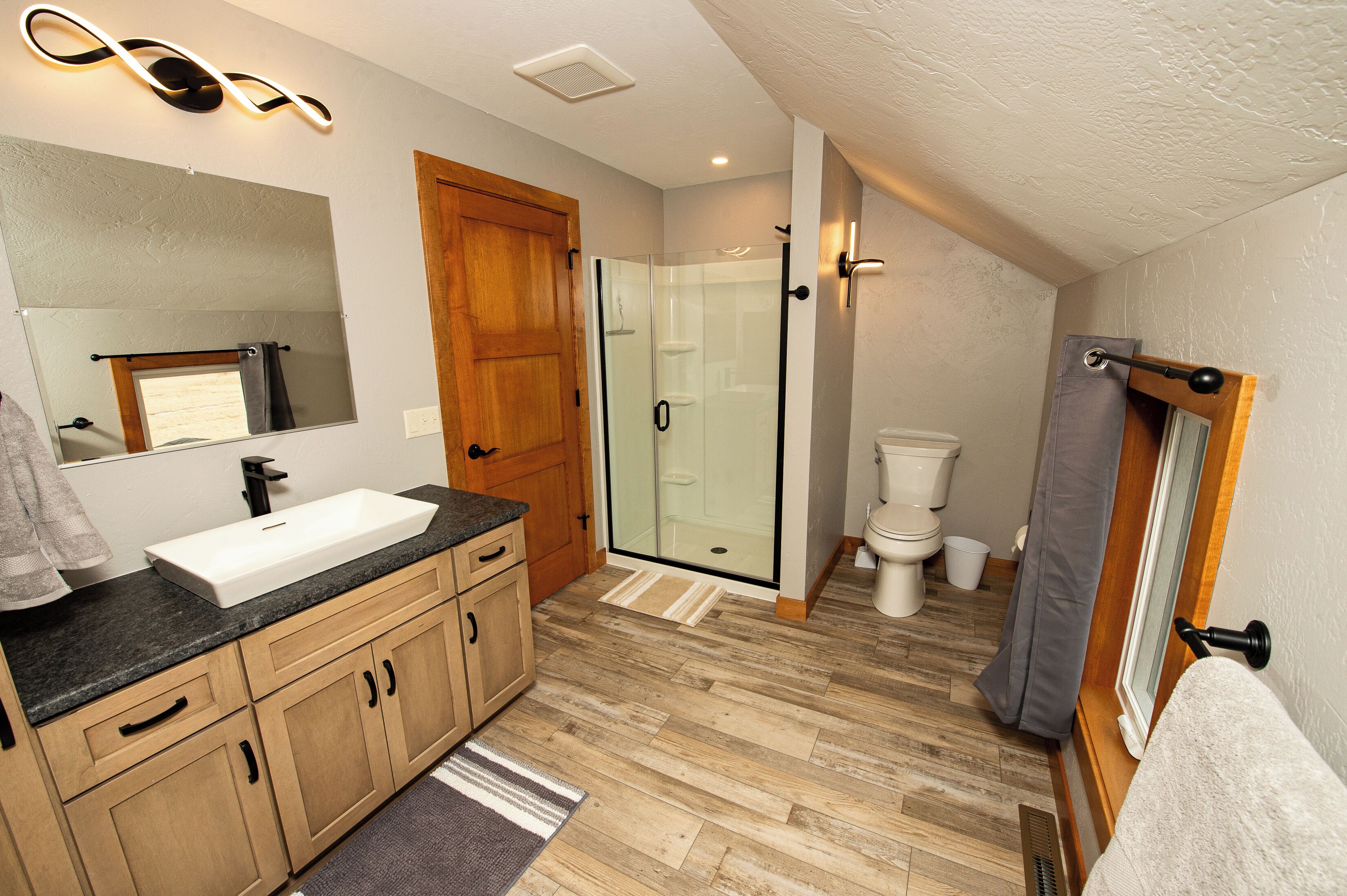 Shower, hair dryer, towels, toilet paper
