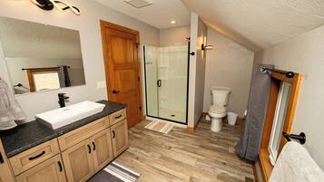Shower, hair dryer, towels, toilet paper