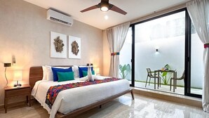 A bedroom with a bed, bedside table, ceiling fan, air conditioning unit, and a view of the outside. - Casa Daniela  (Puerto Morelos)