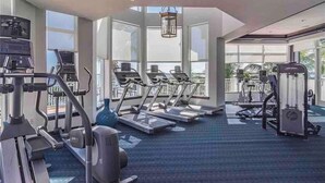 A gym with treadmills, elliptical machines, and weight equipment. - Waterfront condo in beautiful Stuart, Close to Jensen and Stuart beaches. (Stuart)