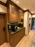 Mini-fridge, microwave, stovetop, cookware/dishes/utensils