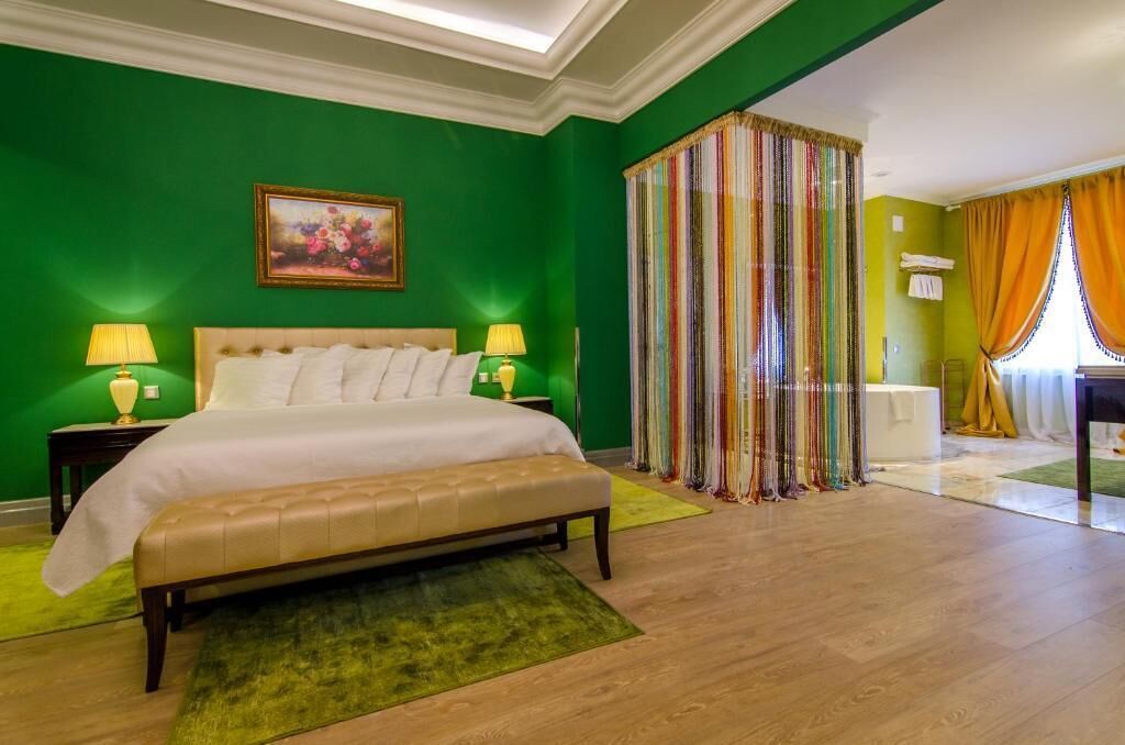Suite Deluxe, balcón, vista al mar | Caja de seguridad en la habitación y insonorización 