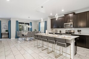 Fridge, microwave, oven, stovetop - Luxury Home with Kids Themed Bedrooms, Games Room and Private Pool! (Davenport)