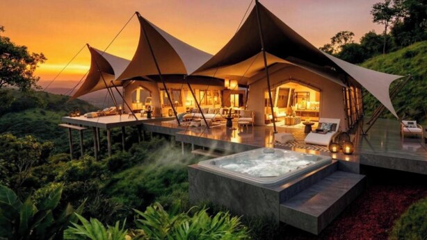A luxurious tented accommodation with a hot tub and outdoor seating. - AURALTA RIO CELESTE I Elohi Collection (Katira)