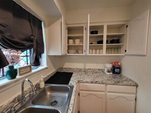 Fridge, microwave, stovetop, coffee/tea maker