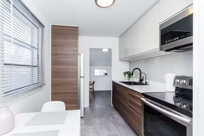 Fridge, microwave, oven, stovetop - Stylish St. Boniface Home | 2 Bed | 1 Bath | (Winnipeg)