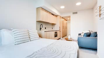 Suite Studio Deluxe, balcon, vue ville | Coin séjour