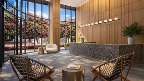 A modern lobby with a reception desk, seating area, and large windows. - The Urban Suites - 501 First Residence (Miami)