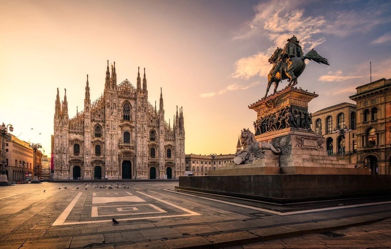 A grand cathedral with intricate Gothic architecture, a large open plaza, and a statue of a historical figure on horseback.