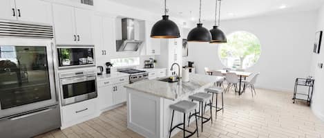 Coffee/tea maker, fridge, microwave, oven