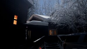 A house with a snow-covered roof and a visible window. - Spacious, Inviting, and Beautiful 4 Bedroom Home (Fairbanks)