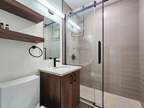 Shower, hair dryer, towels, soap - Open-Concept River Heights Home | 3 Bed | 2 Bath | (Winnipeg)
