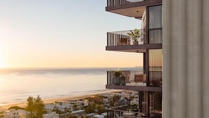 A multi-story building with balconies overlooking a beach. - Yves Residences - 2204 (Mermaid Beach)