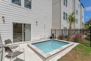 A residential building with a swimming pool, sliding glass doors, and a fenced patio area. - 🏝️Villas at Laguna Beach 1 | Gulf Views + Private Pool | Steps to Beach Access (Panama City Beach)